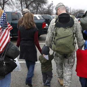 A soldier walks with his family following a 2011 ceremony at Fort Hood, Texas, for soldiers from the U.S. Army 1st Cavalry 3rd Brigade, who returned home from deployment in Iraq